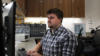PhD Student Caden Hamrick works at a lab computer